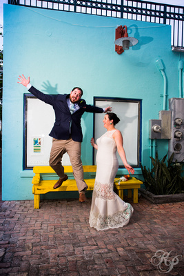 Groom being goofy jumping off a bench in Key West