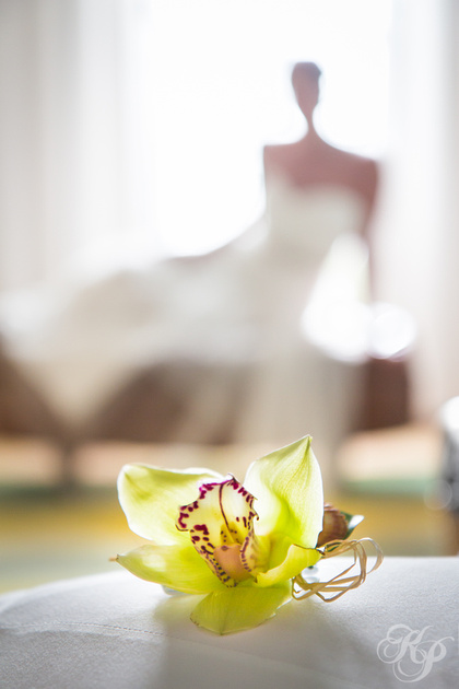 Bride in window with orchid