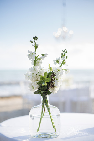 Simple floral arrangement on white linen