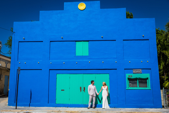 Bahama village blue and green building with wedding couple
