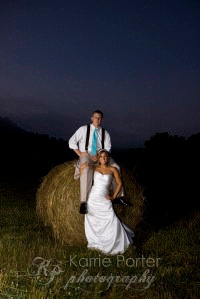 bride and groom portrait on hay bale karrie porter photography