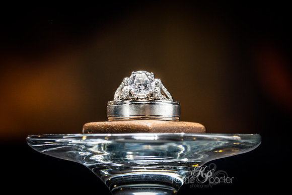 Macro image of wedding ring diamond with blurry fire in background